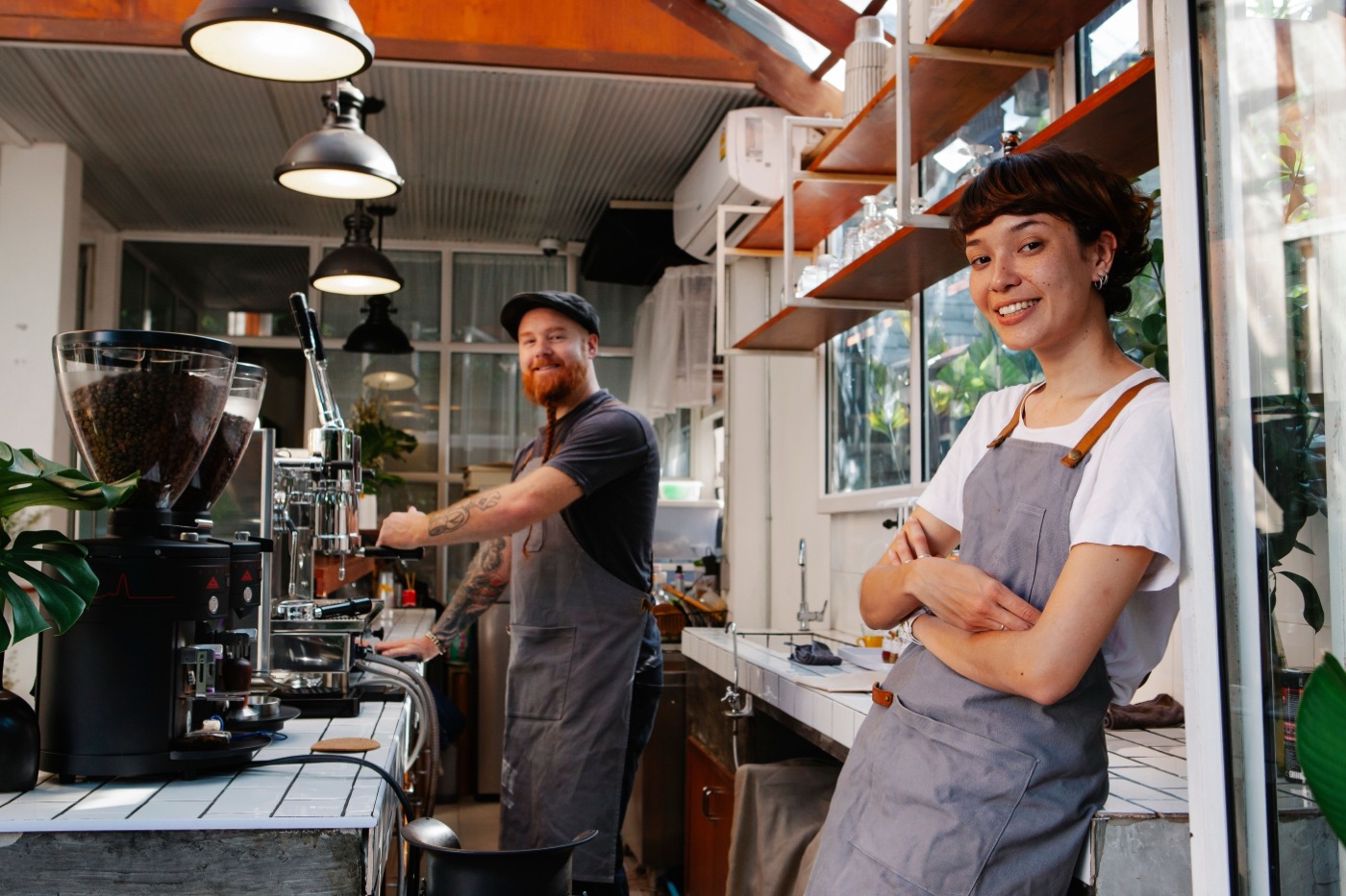 Two café owners behind their counter