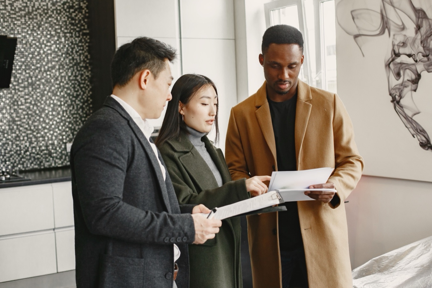 A property manager walking tenants through a lease