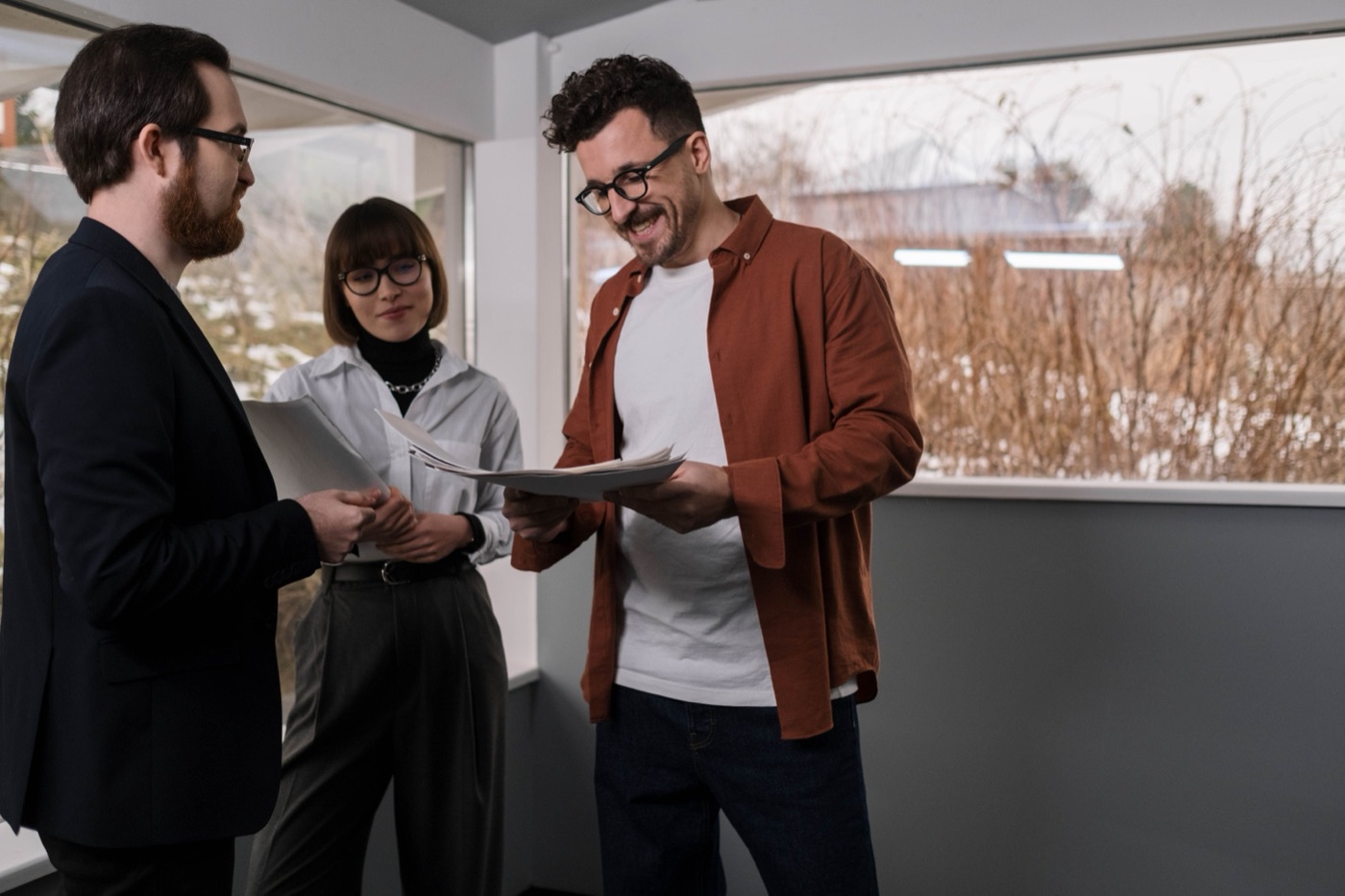 A family reviewing plans inside an empty commercial space